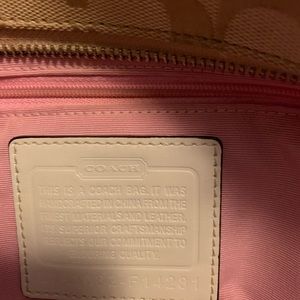 White cloth and leather Coach purse. Light wear.